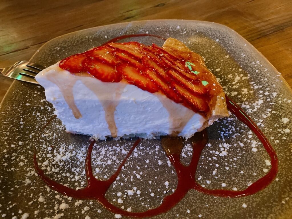 Slice of pie with strawberries on top at Moku kitchen on Oahu. 