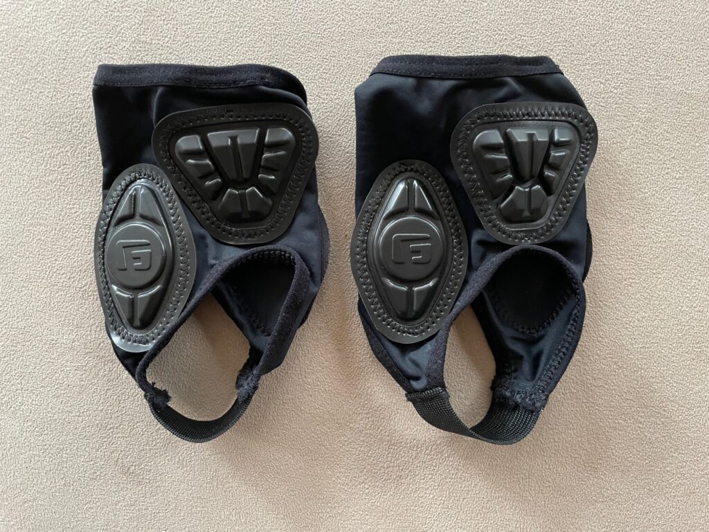 A photo of black skateboarding ankle guards. The brand is G-Form Pro Ankle protectors. 
