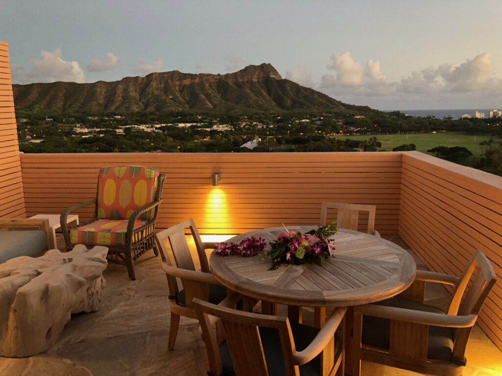 View of Diamond Head state monument from a lanai of Queen Kapiolani at sunset. 