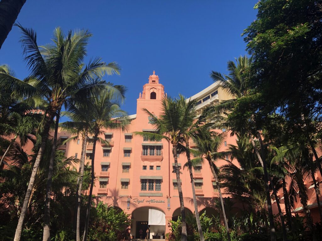 The front pink facade of the Royal Hawaiian Resort in Waikiki, Hawaii. 