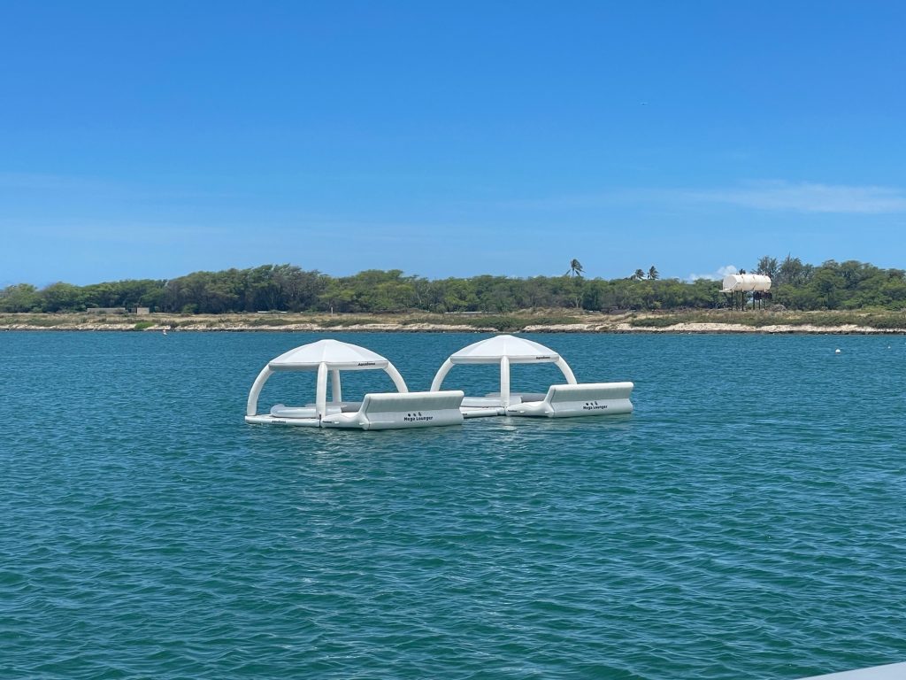 Floating luxury cabanas at Wai Kai on the lagoon on a sunny day. Photo by Marla Cimini