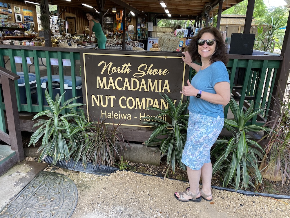 Author Marla Cimini standing in front of the North Shore Macadamia Nut Company store. 
